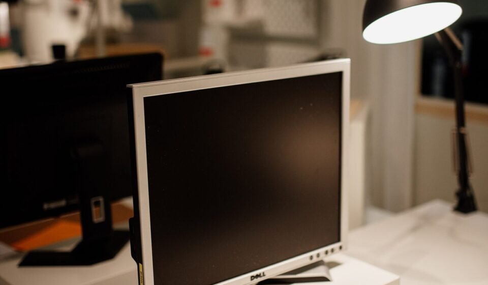Airtable After Bending Spoons (Oct 12, 2026): What ‘Back to Bases’ Means for Your Workspace Computer monitor and desk lamp on a workspace desk
