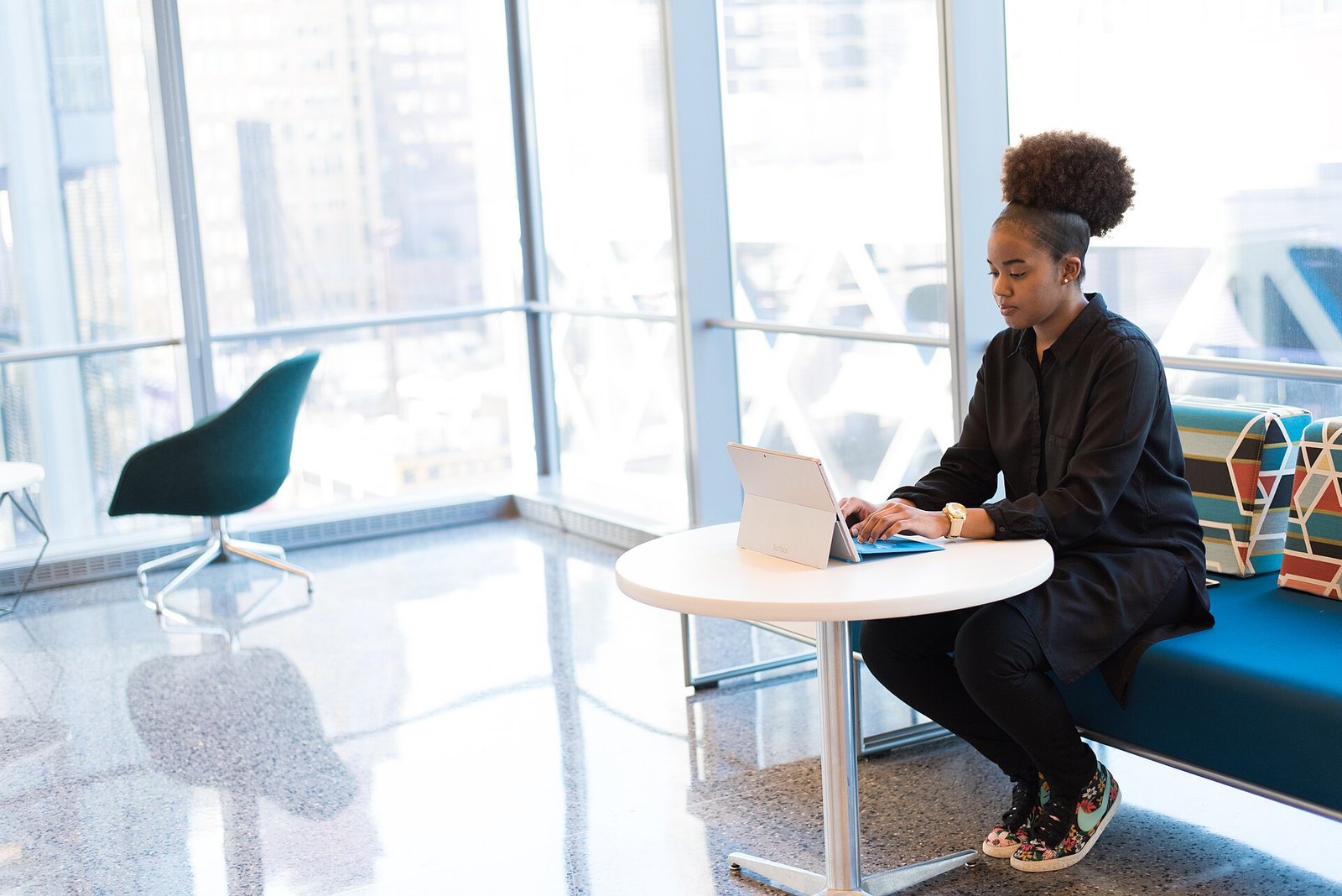 Woman working on a laptop at an office desk