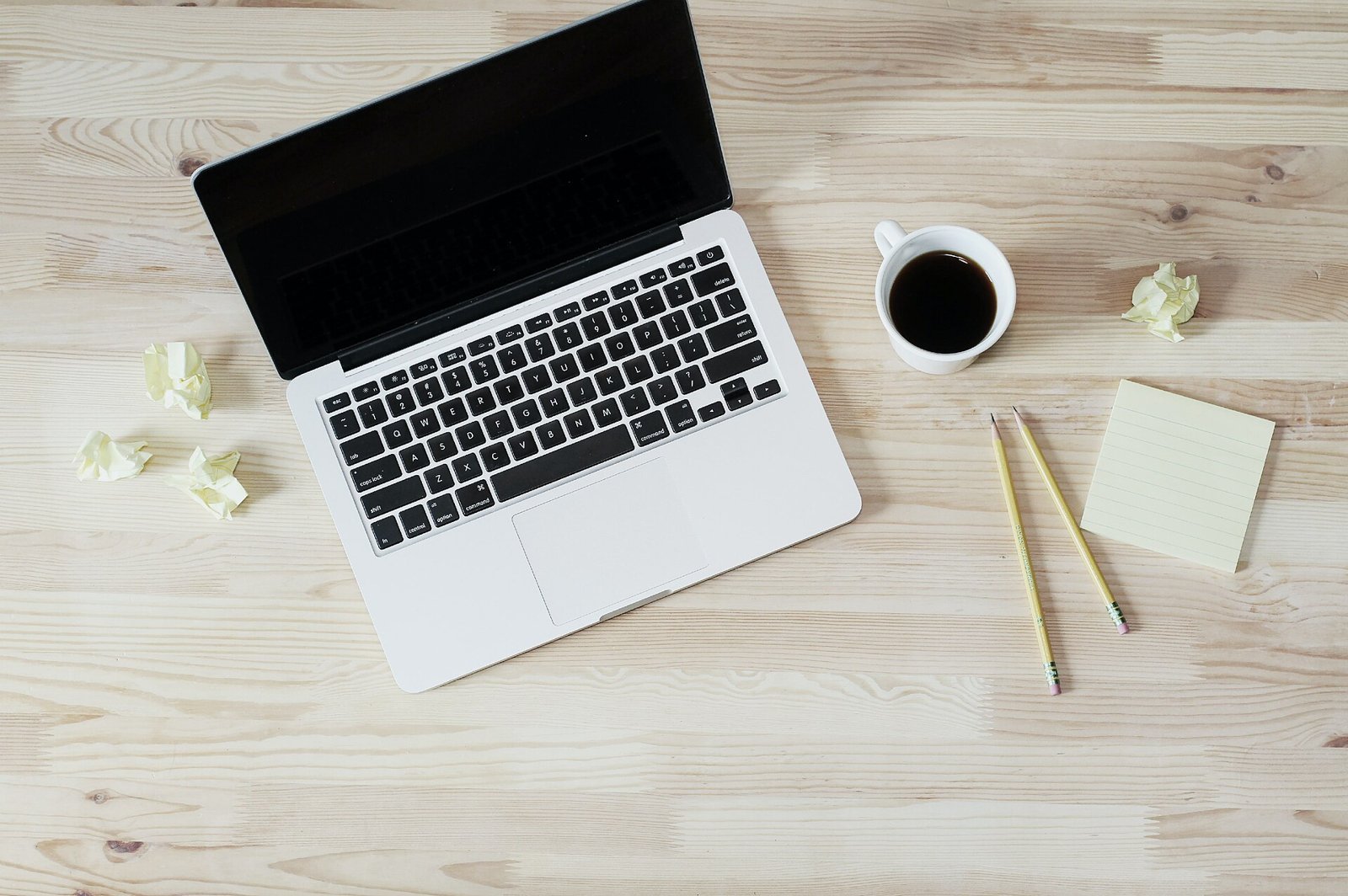 Laptop and coffee on a tidy desk