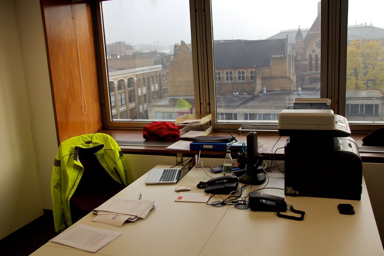 Office desks with computers in a shared workspace