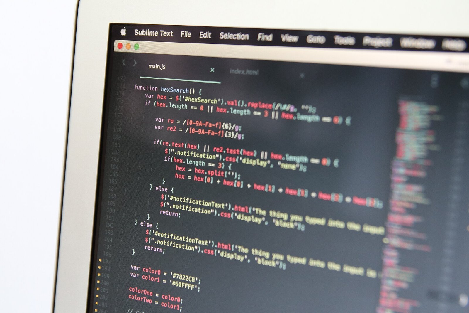 Close-up of a laptop showing code in an editor