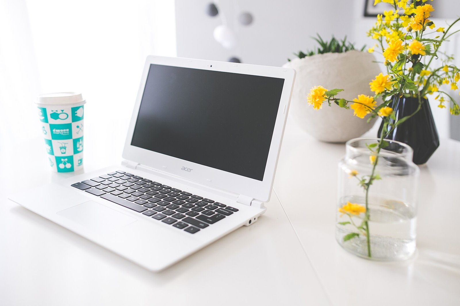 Laptop with coffee for Slack-style work